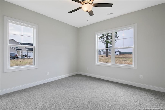 unfurnished room featuring carpet floors and ceiling fan