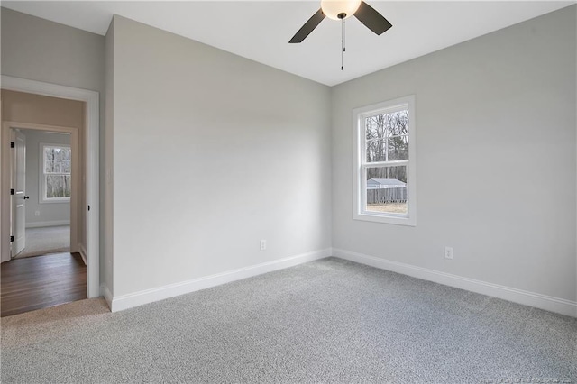 carpeted empty room with ceiling fan