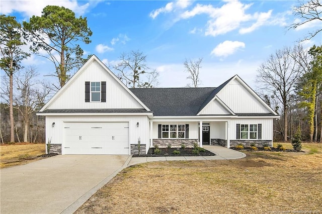 1237 Joe Hall Rd, Hope Mills, NC 28348 - modern inspired farmhouse featuring driveway, a shingled roof, a front yard, stone siding, and a garage