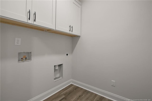 1237 Joe Hall Rd, Hope Mills, NC 28348 - laundry area featuring cabinet space, baseboards, dark wood-type flooring, hookup for a washing machine, and electric dryer hookup