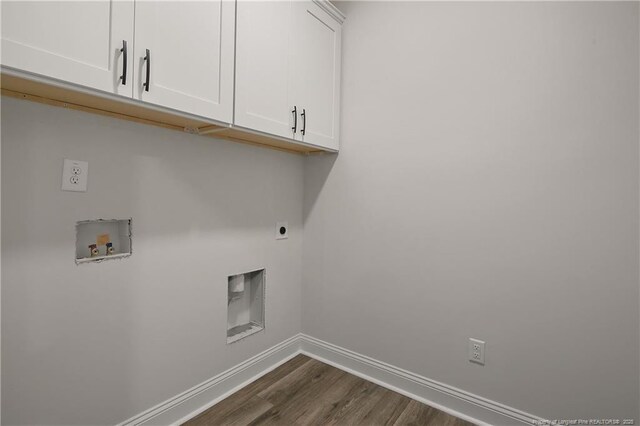 1237 Joe Hall Rd, Hope Mills, NC 28348 - laundry area featuring cabinet space, baseboards, dark wood-type flooring, hookup for a washing machine, and electric dryer hookup