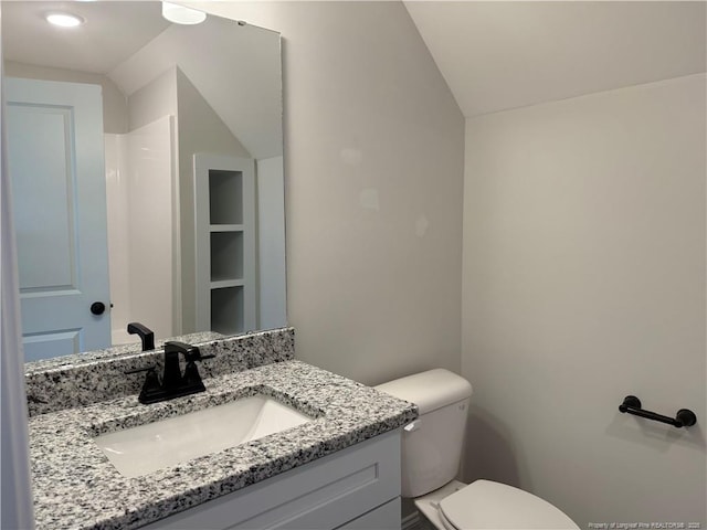 1237 Joe Hall Rd, Hope Mills, NC 28348 - bathroom featuring lofted ceiling, vanity, and toilet