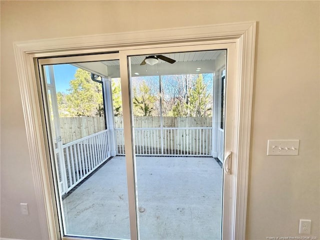 doorway to outside featuring ceiling fan