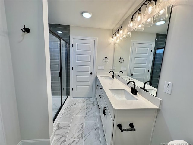 bathroom featuring vanity and an enclosed shower