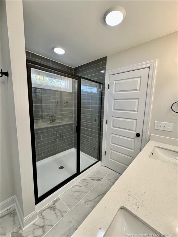 bathroom with vanity and an enclosed shower