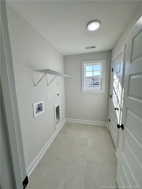 laundry area featuring hookup for an electric dryer and hookup for a washing machine