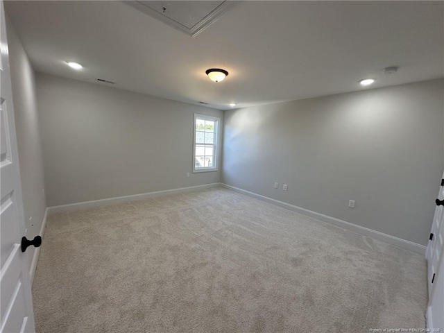 spare room with light carpet