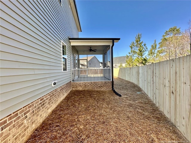 view of yard featuring ceiling fan