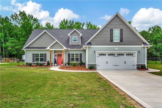 craftsman house with a garage and a front lawn