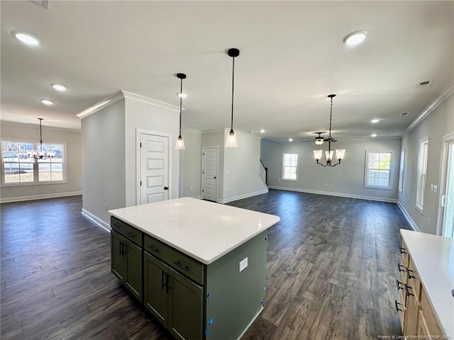 kitchen with pendant lighting, a center island, dark hardwood / wood-style floors, and a chandelier