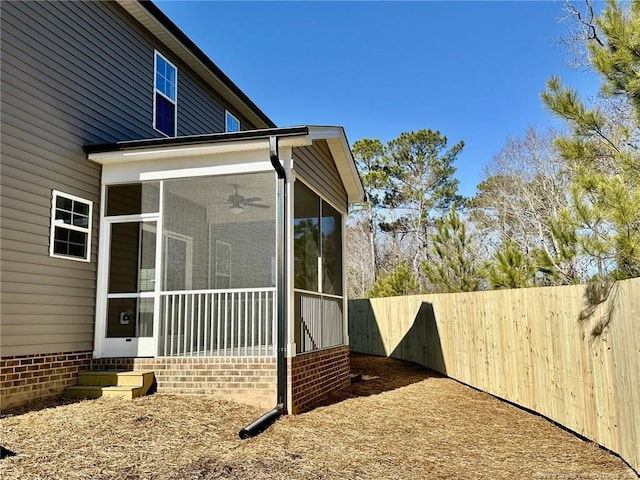 view of home's exterior featuring a sunroom