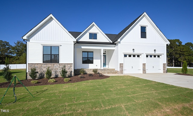 modern farmhouse style home featuring a front yard and a garage