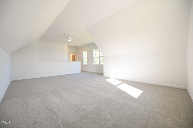 bonus room with ceiling fan, carpet floors, and vaulted ceiling