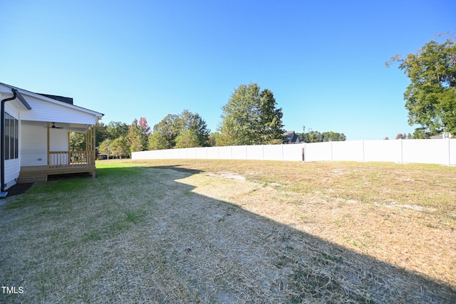 view of yard with ceiling fan