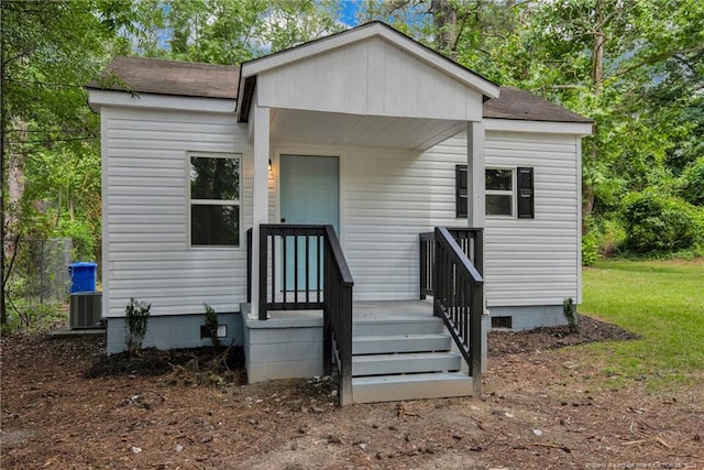 rear view of house with central AC