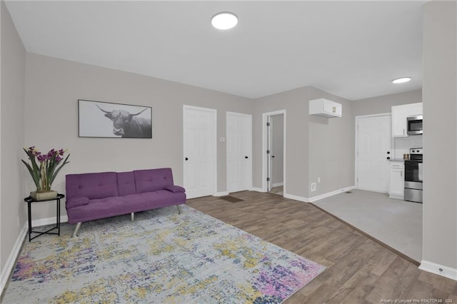 sitting room with hardwood / wood-style floors