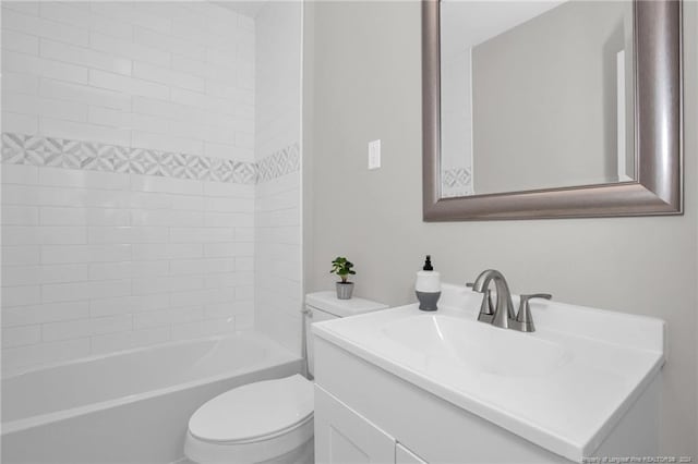 full bathroom with vanity, toilet, and tiled shower / bath