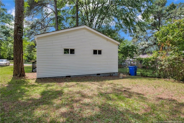 view of property exterior with a lawn