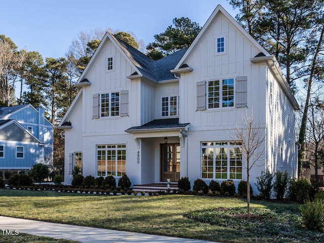 modern farmhouse with a front yard