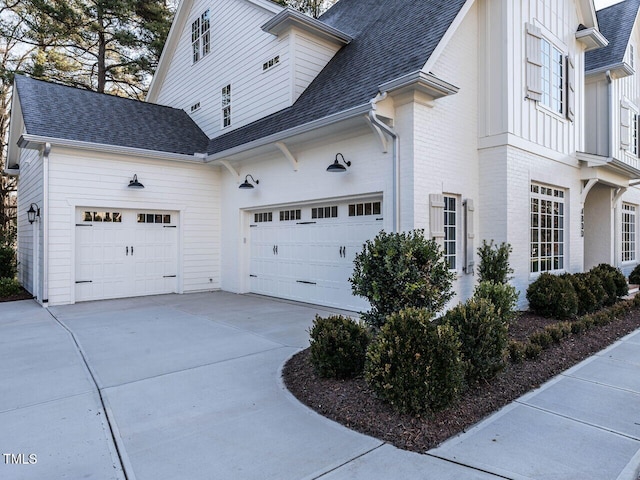 view of side of home with a garage