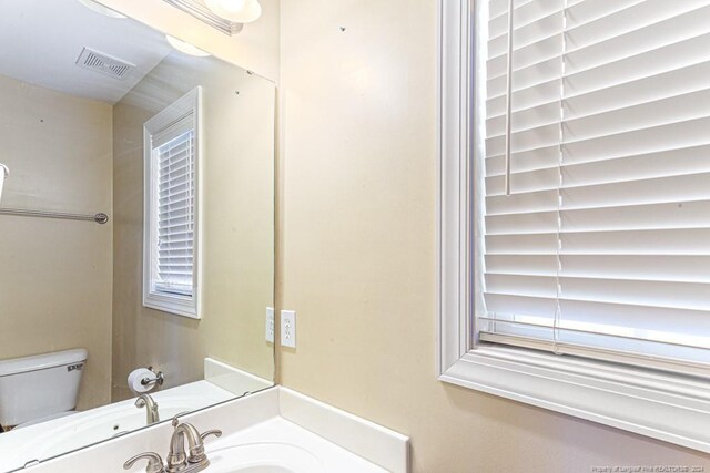 bathroom with sink and toilet