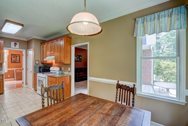 dining room with a textured ceiling, light tile patterned flooring, and crown molding