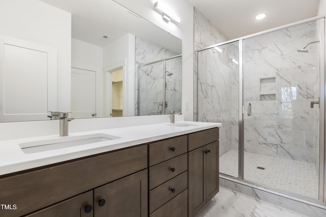 bathroom with vanity and an enclosed shower