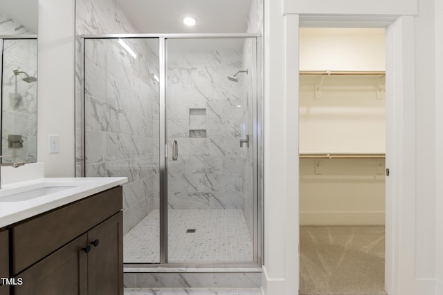 bathroom with vanity and walk in shower