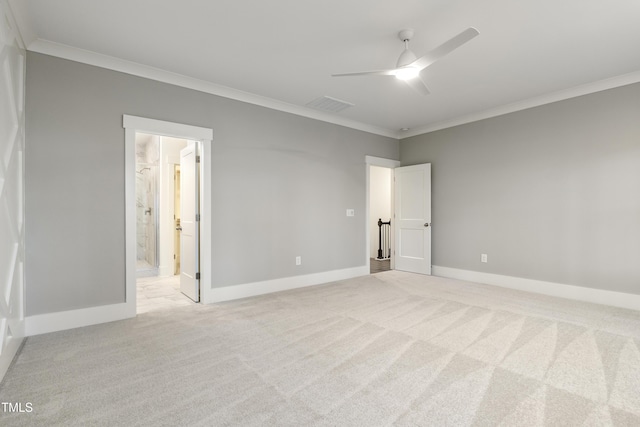 carpeted empty room featuring ceiling fan and ornamental molding