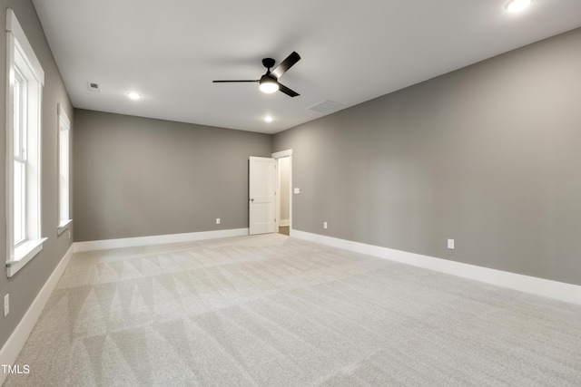 carpeted empty room with ceiling fan