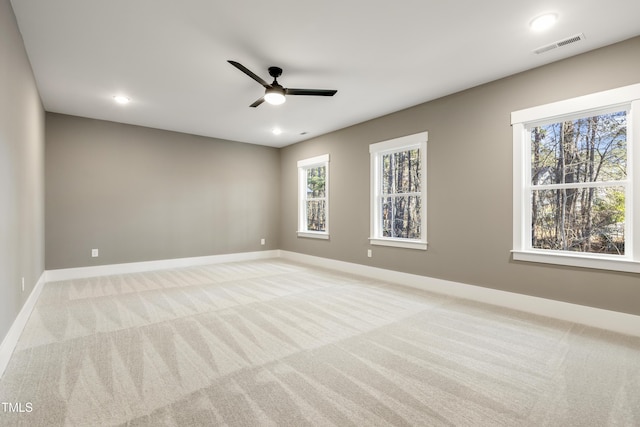 carpeted empty room with ceiling fan