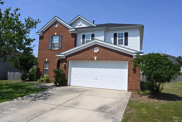 front facade featuring a front yard and a garage