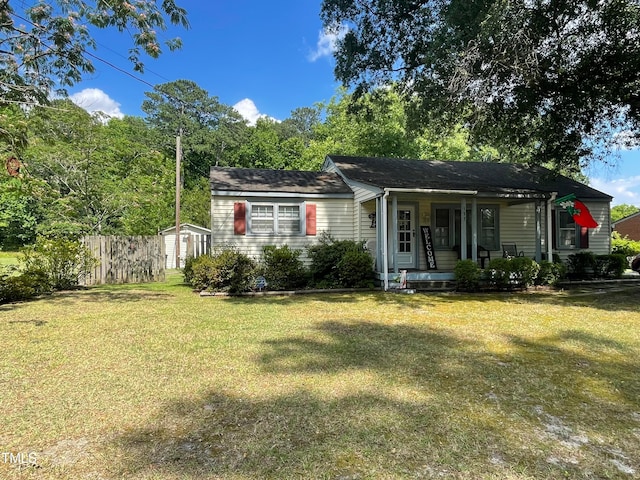 view of front of home featuring a front lawn and covered porch