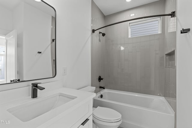 bathroom featuring shower / washtub combination, vanity, and toilet