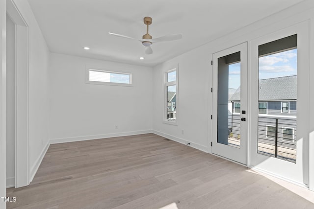 unfurnished room featuring light wood finished floors, ceiling fan, baseboards, and recessed lighting