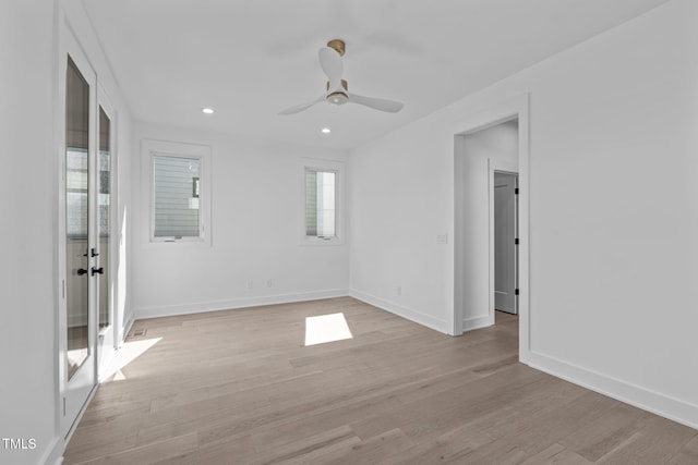 unfurnished room featuring a ceiling fan, recessed lighting, light wood-style flooring, and baseboards