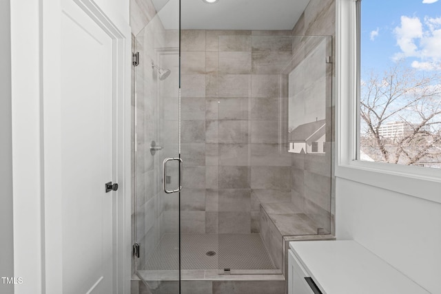 bathroom with a shower stall