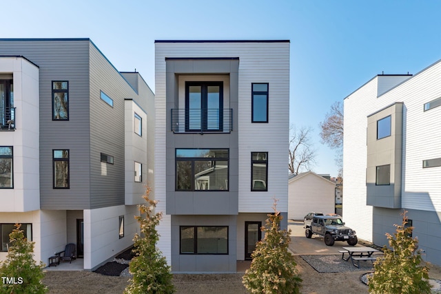 back of property featuring stucco siding