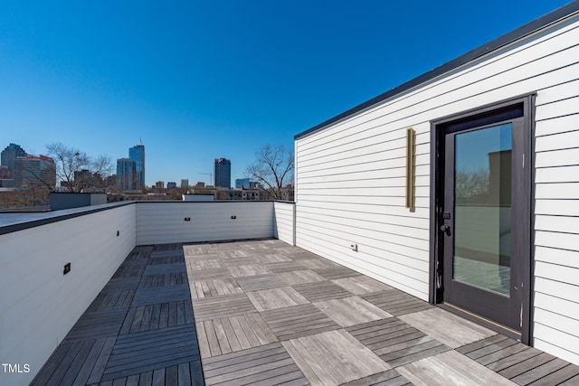 exterior space with a balcony and a view of city