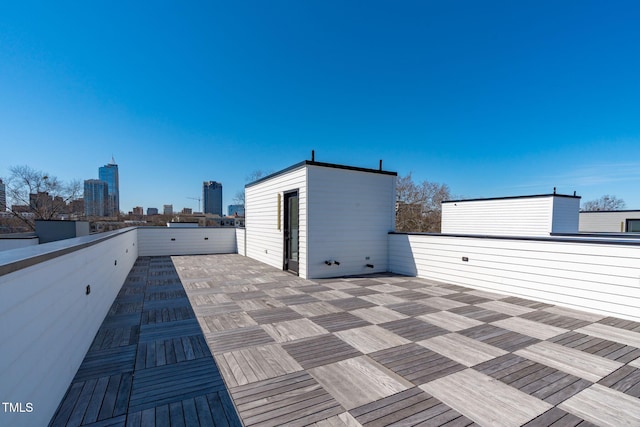 view of patio / terrace with a balcony and a city view