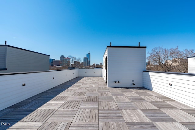 view of patio / terrace with a balcony and a city view