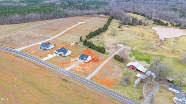 bird's eye view featuring a rural view and a water view