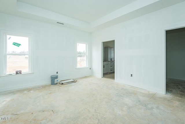 spare room featuring a tray ceiling