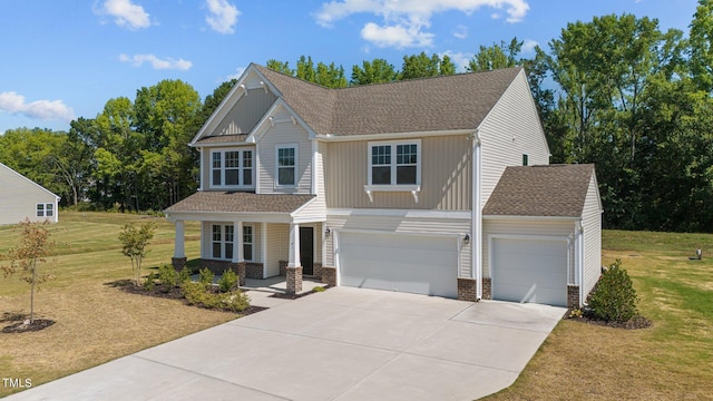 craftsman-style home featuring a garage and a front yard