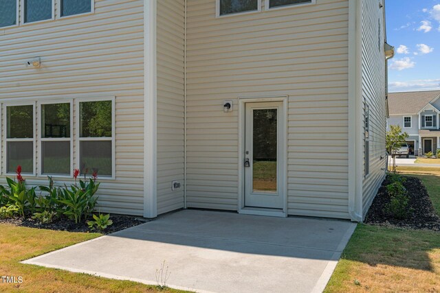 property entrance with a patio area