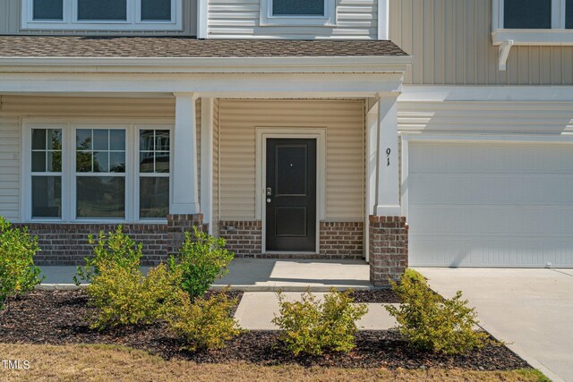 entrance to property featuring a garage