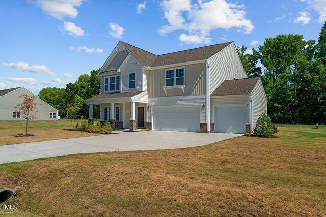 craftsman inspired home featuring a porch, a garage, and a front yard