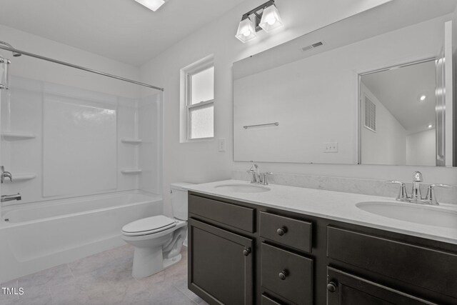 full bathroom with tile patterned flooring, toilet, washtub / shower combination, and double sink vanity