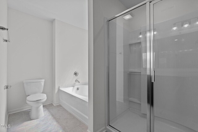 bathroom with tile patterned flooring, toilet, and separate shower and tub