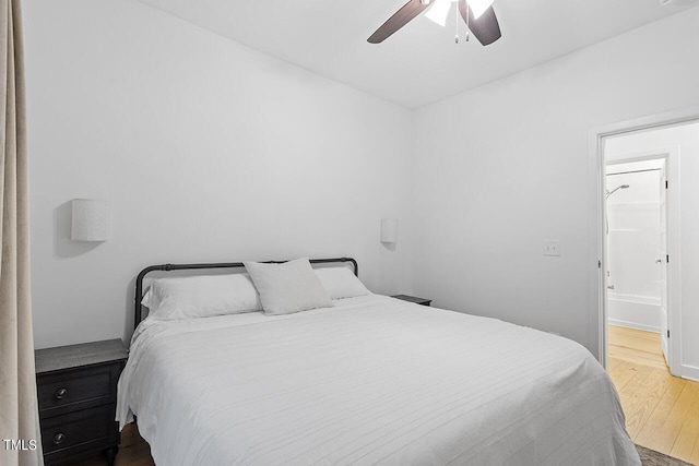 bedroom with hardwood / wood-style flooring and ceiling fan